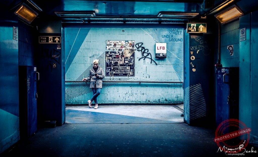 Woman on Mobile at Old Street Tube Station