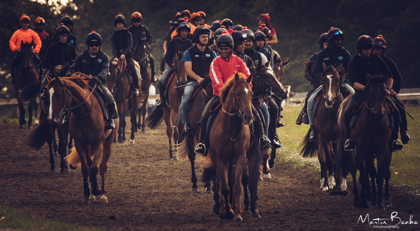 Racehorses and Jockeys on the Newmarket Gallops
